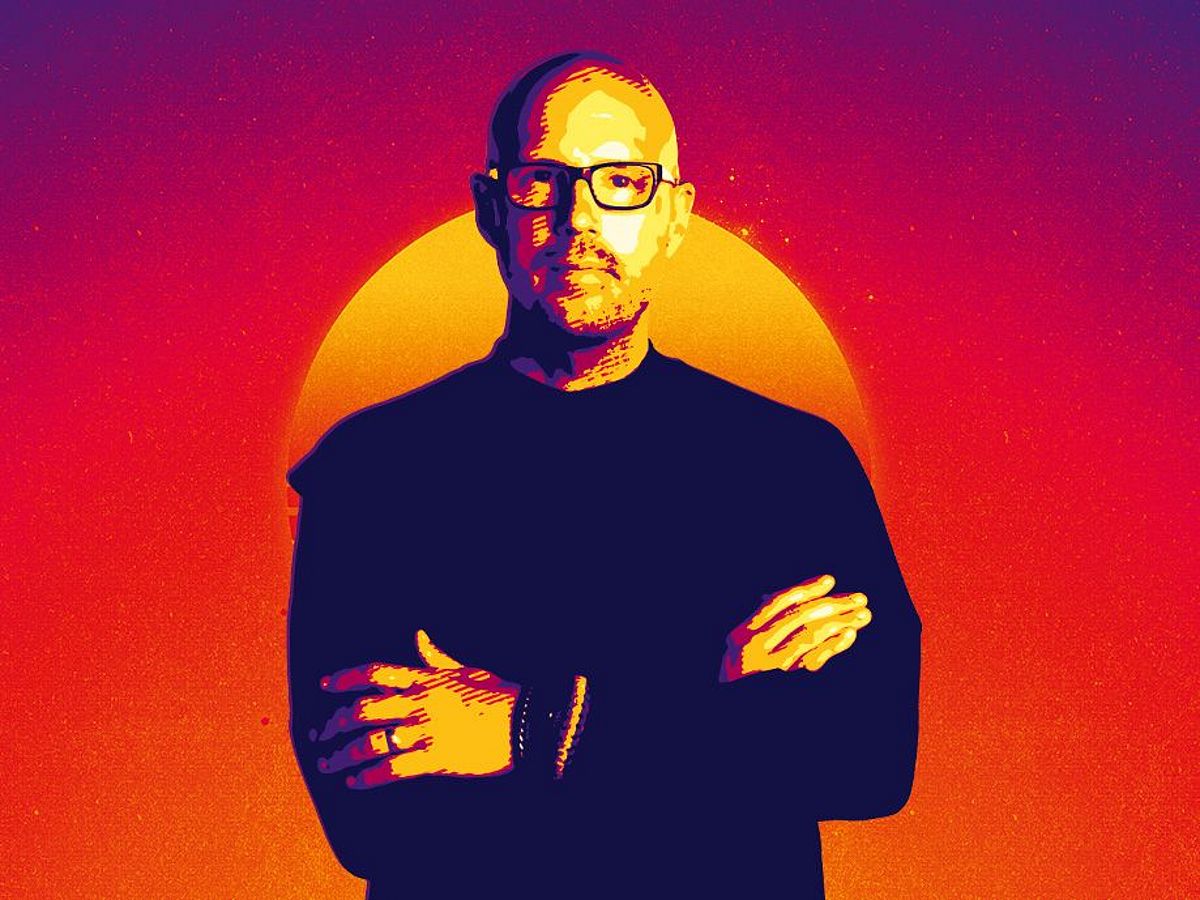 Es ist eine verpixelte Grafik mit einem rot-orangenen Hintergrund. Im Vordergrund steht Schiller in schwarzer Kleidung und mit einer schwarzen Brille. Auch er ist verpixelt. Genau hinter ihn ist ein rot-gelber Kreis, ähnlich einer Sonne. . 